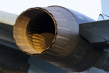 Fighter jet engine exhaust, military aircraft rear view, plane nozzle with part of wing and...