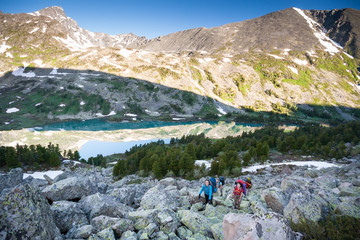 Naklejka premium Young people are hiking in highlands of Altai mountains, Russia