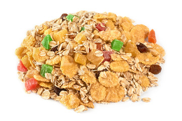 Muesli with dried fruit and candied fruit on a white background.