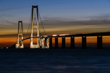Fototapeta na wymiar Sunset behind Storebælt bridge