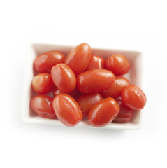 Dish filled with red cherry tomatoes