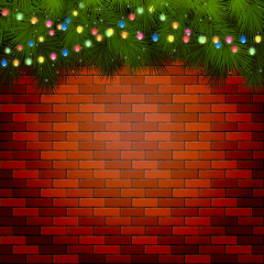 Christmas lights with spruce branches on a brick wall