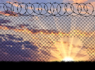  Silhouette of a hole in the barbed