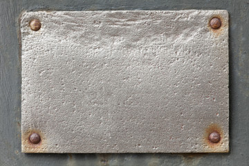 silver metal plate on grey background