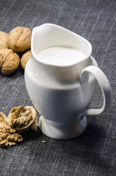 jug of milk and walnuts