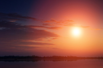 Fototapeta na wymiar Nice landscape with sunset on lake.