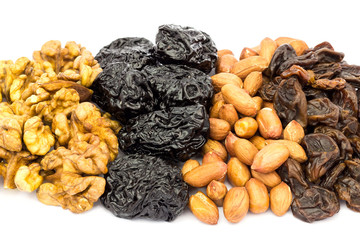 Mix of nuts and dried fruits isolated on white background