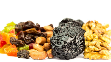 Mix of nuts and dried fruits isolated on white background