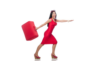 Woman in red dress with suitcase on white