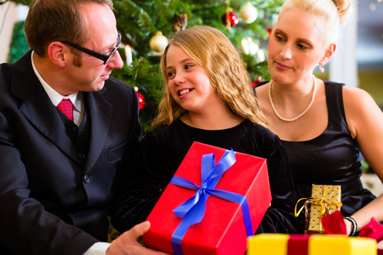 Family with Christmas gifts on boxing day