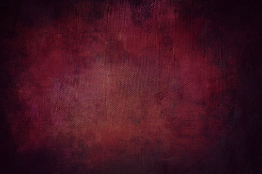 red grunge background or texture with black vignette borders