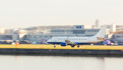 Panning view of an airplane taking off or landing