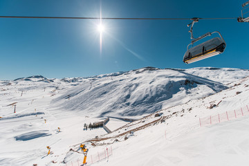 Ski lifts durings bright winter day