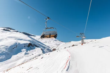 Fotobehang Ski lifts durings bright winter day © Elnur