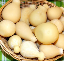 basket of caciocavallo cheese for sale on the Italian market