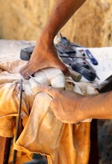 craftsman hand while sculpting Alabaster stone