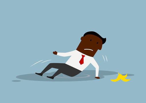 Cartoon businessman slipped on a banana peel