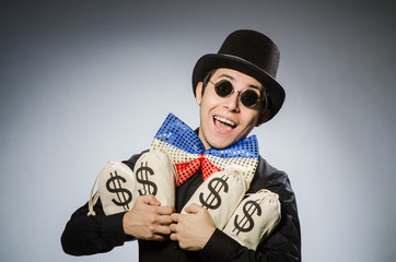 Funny man with money dollar sacks