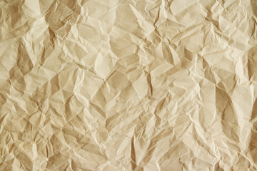 Old crumpled parchment texture. Beige paper sheet as background.