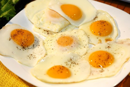 fried eggs topped with a little 'spice and pepper during the bre