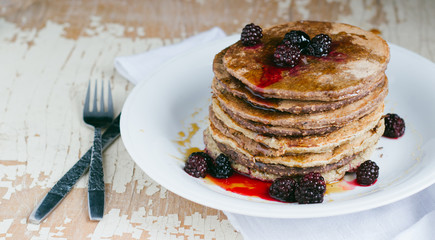 Whole wheat oatmeal pancakes with blackberry and syrup