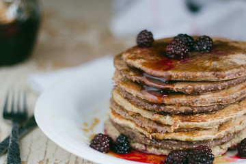 Whole wheat oatmeal pancakes with blackberry and syrup