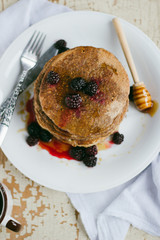 Whole wheat oatmeal pancakes with blackberry and syrup