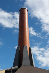 ﻿brick chimney on blue sky
