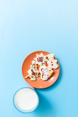 Cookie with milk and christmas tree on the table for Santa Claus