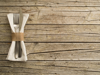 Cutlery kitchenware on old wooden boards background - obrazy, fototapety, plakaty
