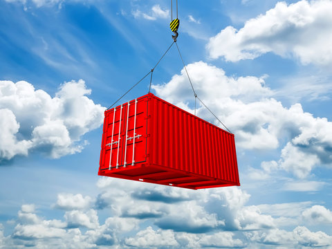 Freight shipping container hanging on crane hook