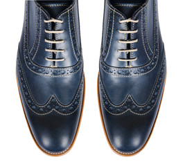 Tip of male shoes isolated on white