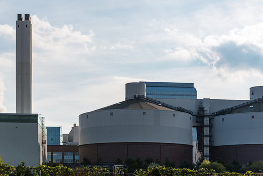Generating plant tiefstack with smokestacks against blue sky in Hamburg. Powerhouse in industrial technology area in Germany 