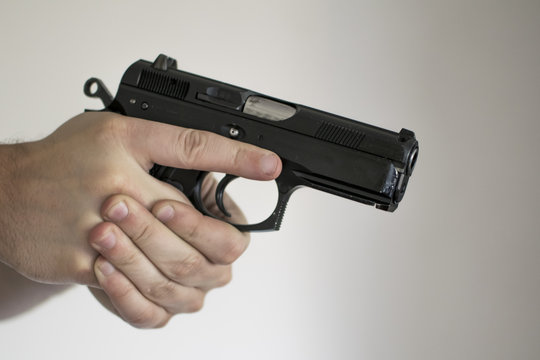 Man drawing handgun in home in self defense