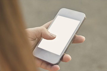 Woman Using a Smart Phone. Vintage filter.