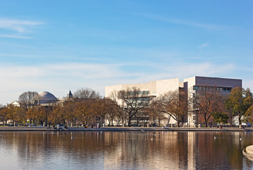The Capitol Reflecting pool and National Art Gallery buildings. US capital city panorama near the reflecting pool at sunset.