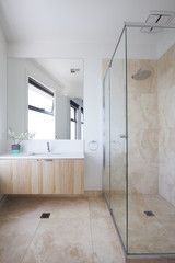 Fototapeta na wymiar Minimilist beige contemporary bathroom in a luxury Australian ho