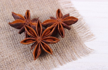 Star anise spice on white wooden table