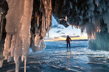 Hiker at the ice cave and across sunrise.
