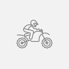 Obraz premium Man riding motocross bike line icon.