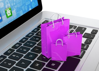 laptop and  shopping pags on white background