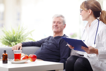 Female doctor and senior patient