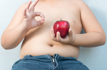 red apple on hand fat boy