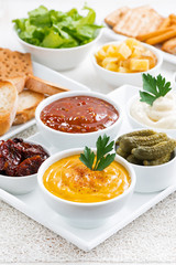 assortment sauces and snacks, vertical