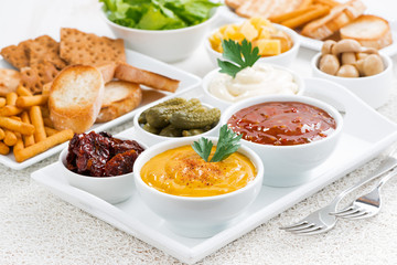 assortment sauces and snacks