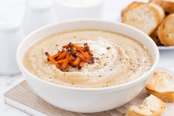 cream soup with caramelized carrots in bowl