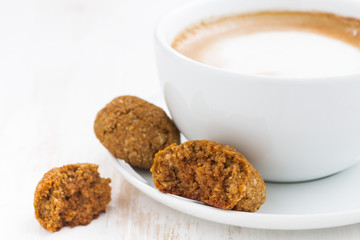 cup of cappuccino and almond cookies, closeup, selective focus