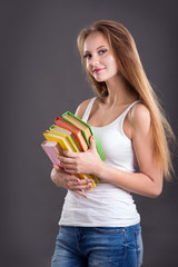 Young teenager girl with books