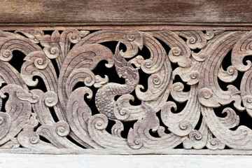 Ancient Naga wood carving in thai temple