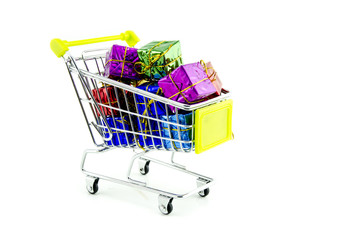 Shopping trolley with colorful Christmas gifts and presents, isolated on white background